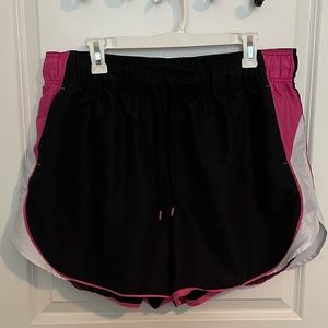 Black and hot pink athletic shorts